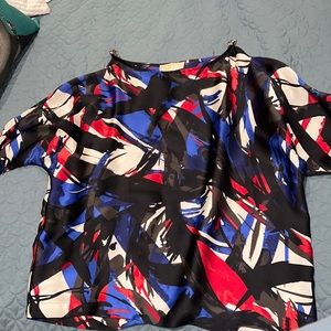 I am selling a Michael Kors blouse in size large. Price negotiable